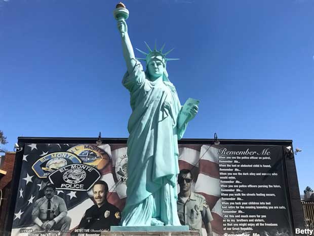 Statue of Liberty Replica and memorial mural.