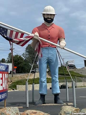 Muffler Man with American flag.