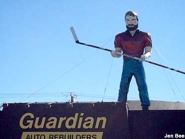 Muffler Man with hockey stick.