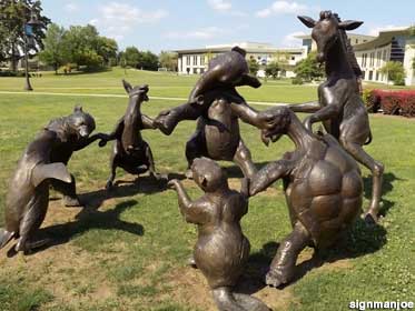 Animals sculptures dance in a circle.