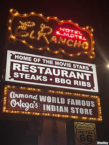 El Rancho Hotel sign at night.